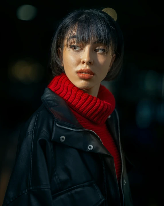 an image of a woman with short hair and bright red scarf