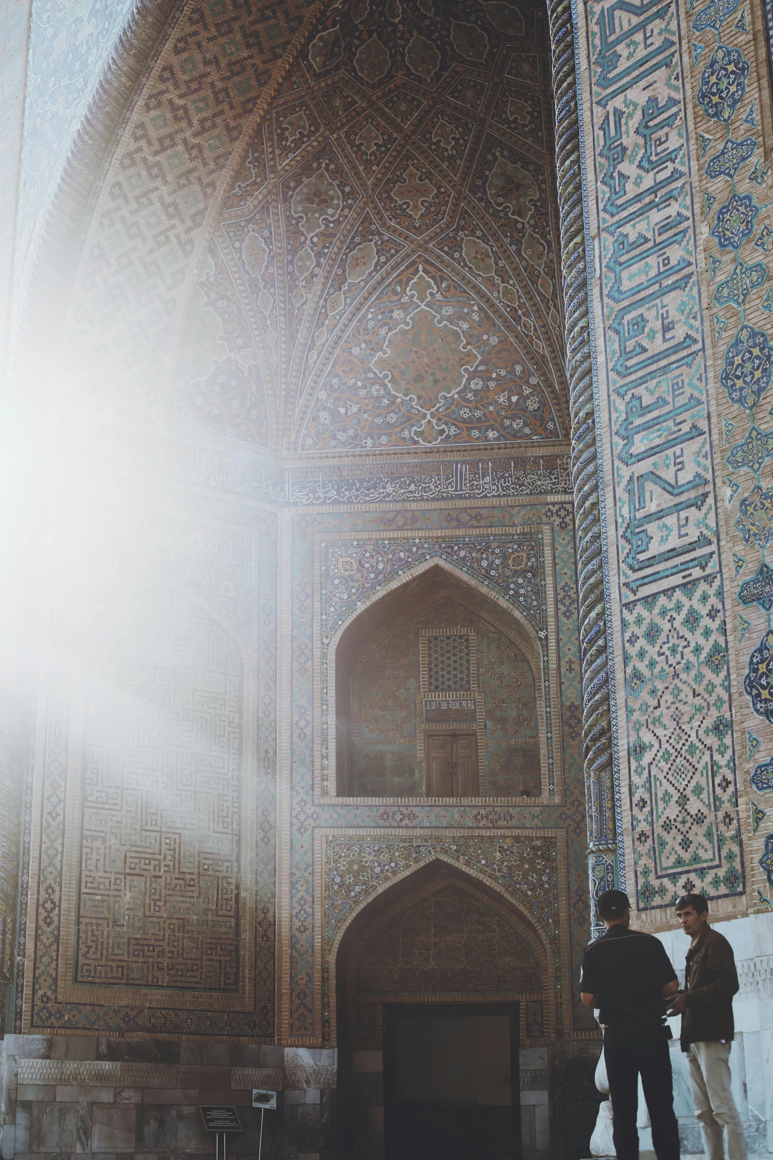 some men are standing in an ornate area