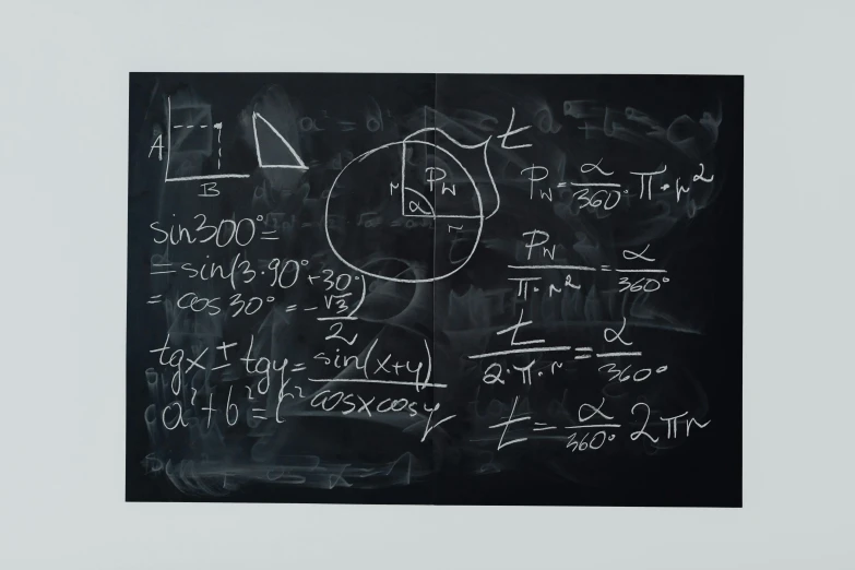 there are math on the board, and the chalk drawing on the blackboard