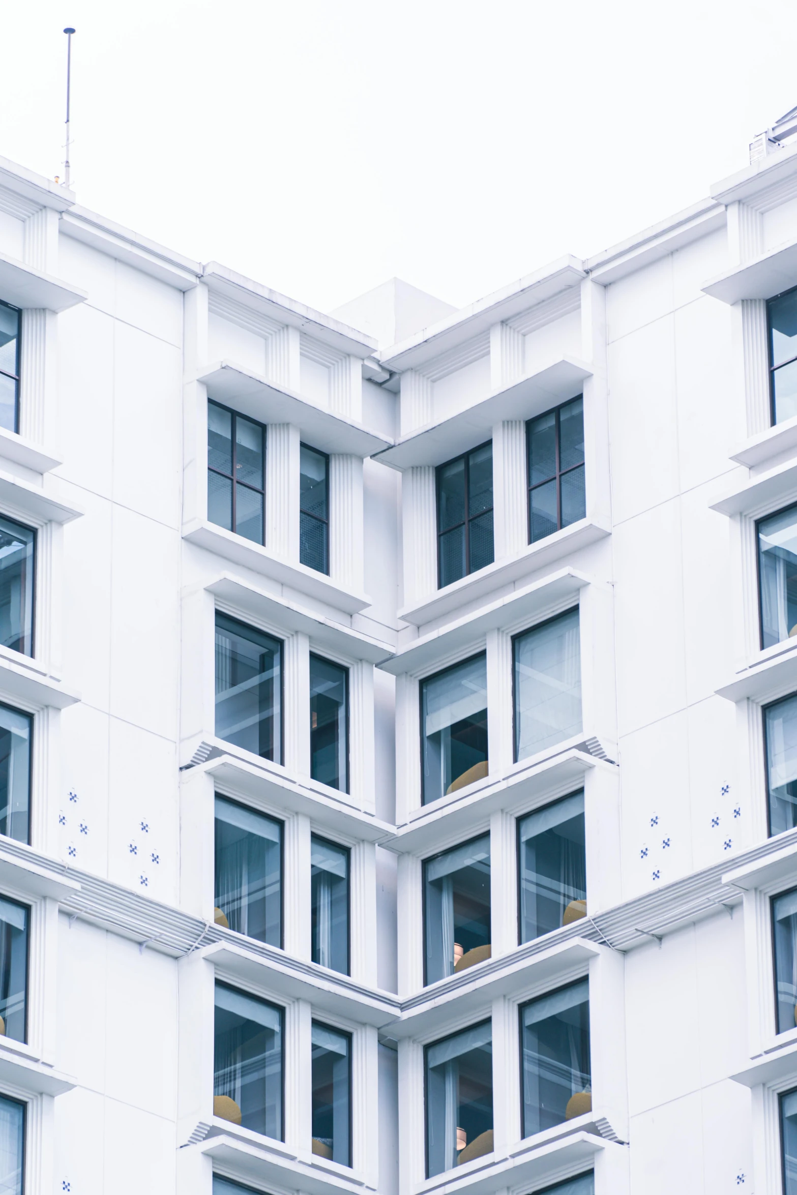 a very tall white building with many windows