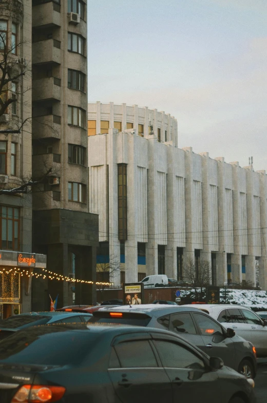 many cars are driving on a busy street