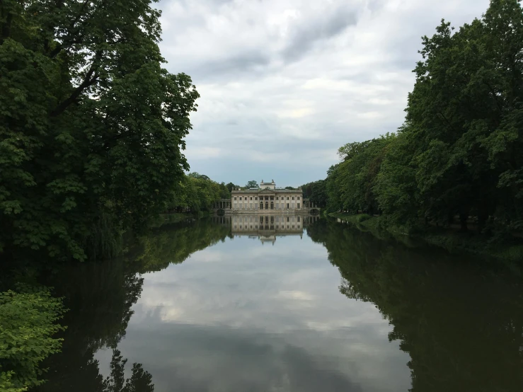 a large body of water surrounded by trees