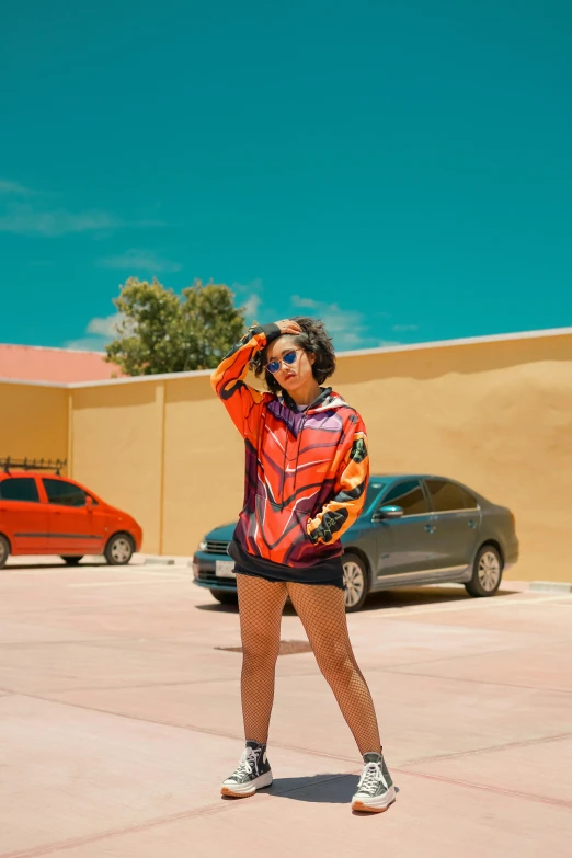 a woman standing in front of a parking lot