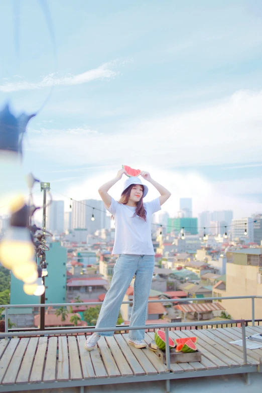 a young woman wearing a hat with a view of buildings