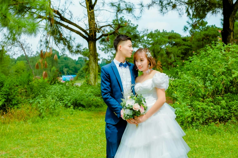 a bride and groom pose together for the camera