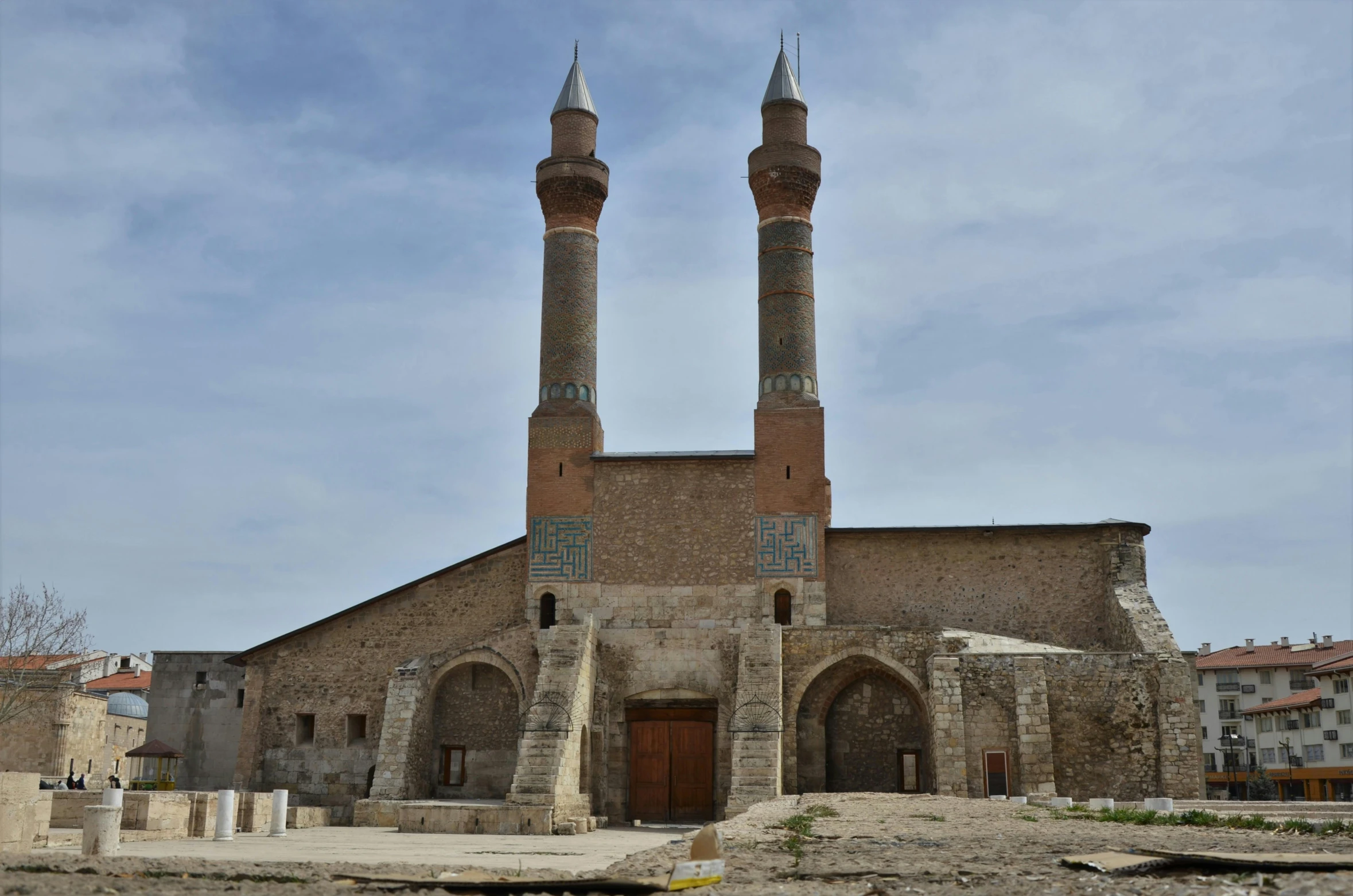 a large church with two towers is in a city square