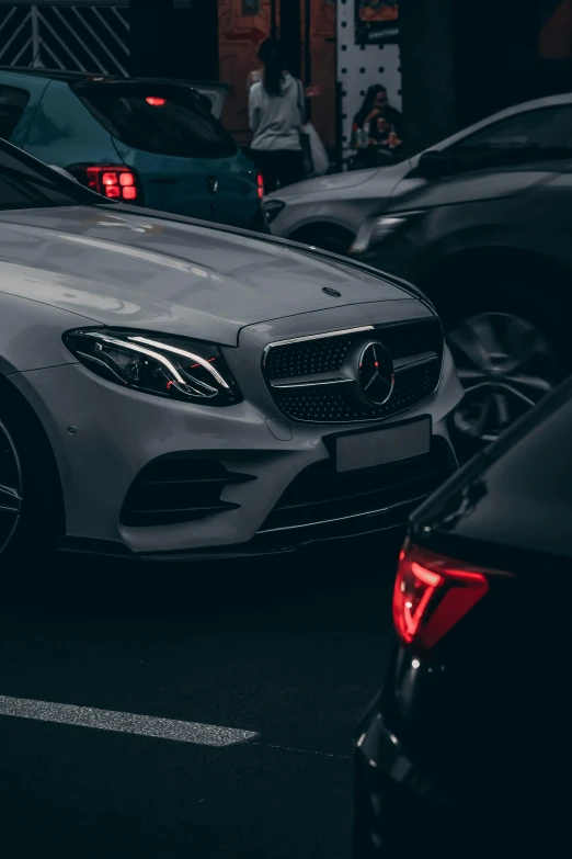 the front view of mercedes benz's car parked in a lot