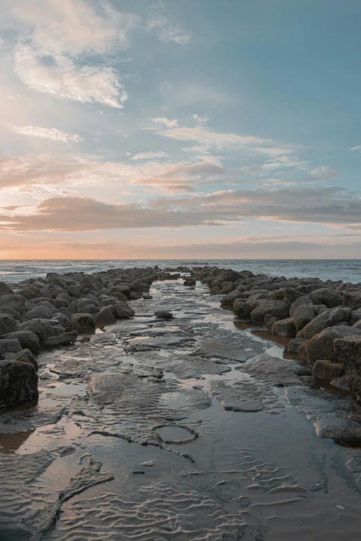 a long stretch of calm water runs between the rocks