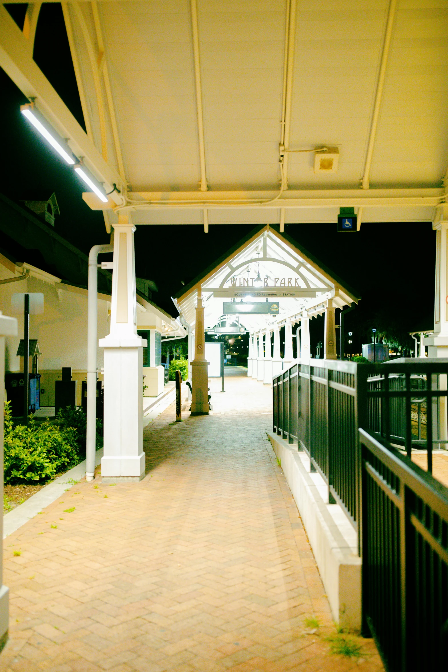 an outside entrance to a train station at night