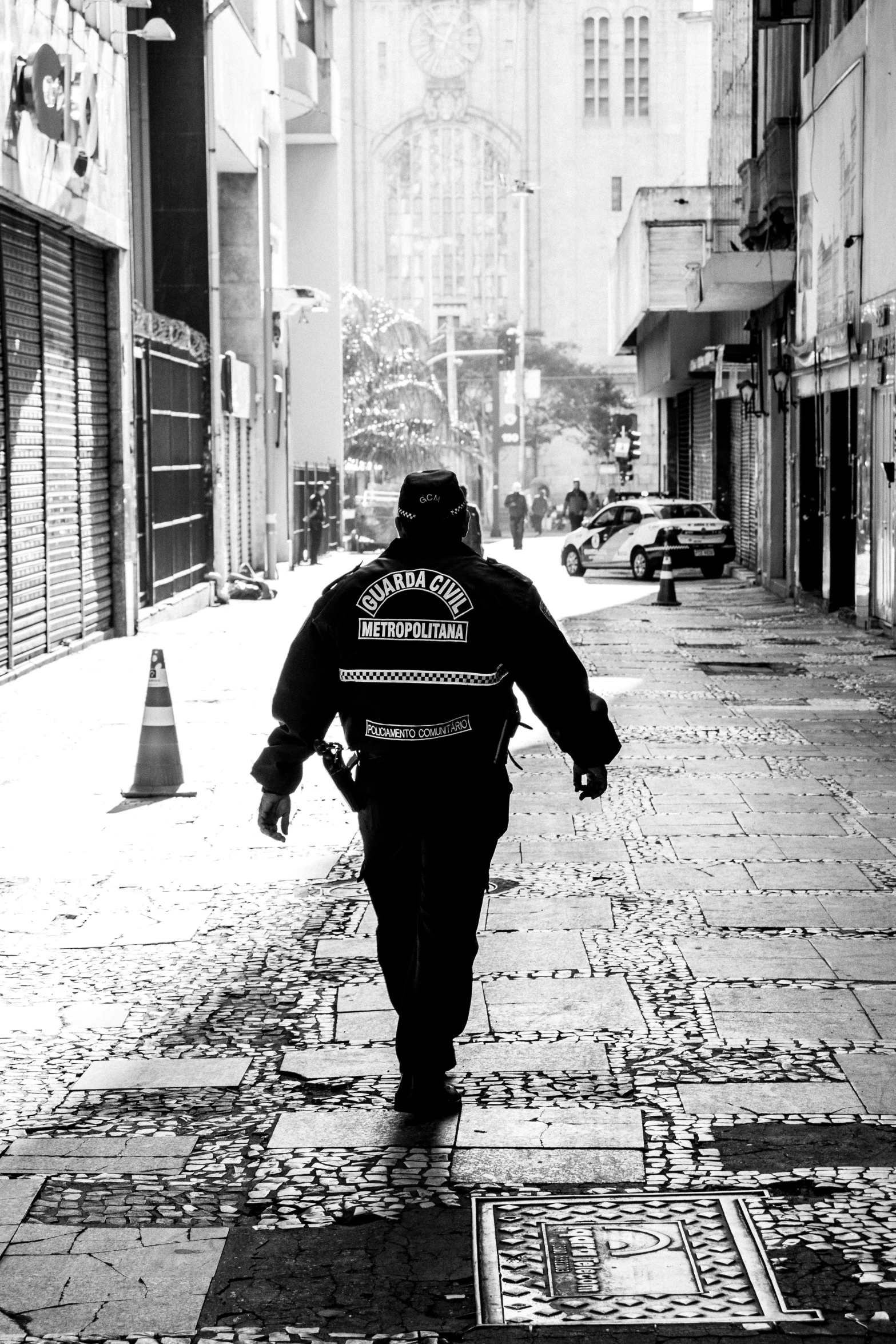 a man walking down a street with an advertit on the side