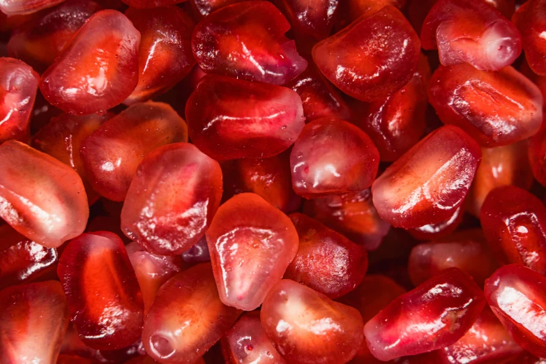 closeup view of red fruit that is mostly covered in ice