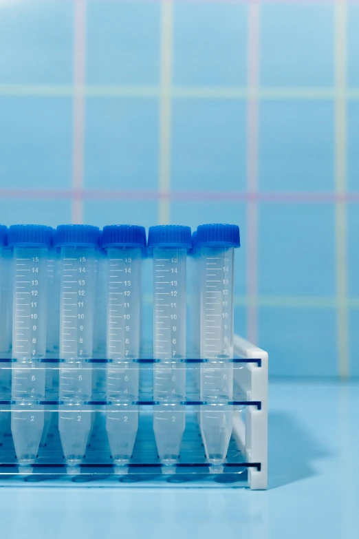 a series of blue and clear plastic cups with handles