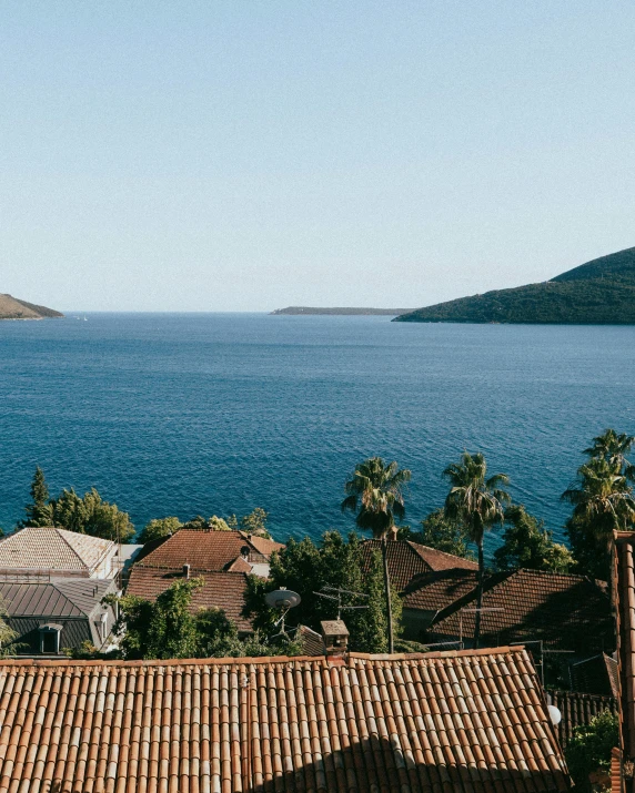 view from a hilltop of a bay and beach