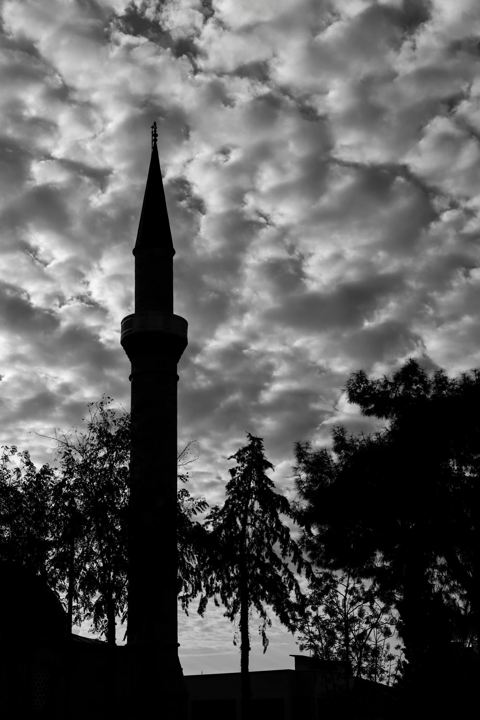 a clock tower with a cloudy sky in the background