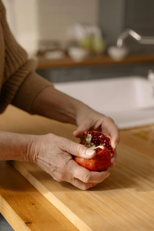 a close up of someone holding an apple