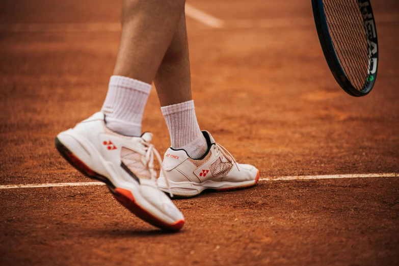 close up view of tennis player's foot on court