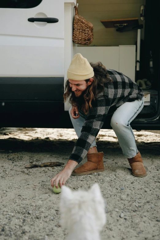 a man standing next to a white truck