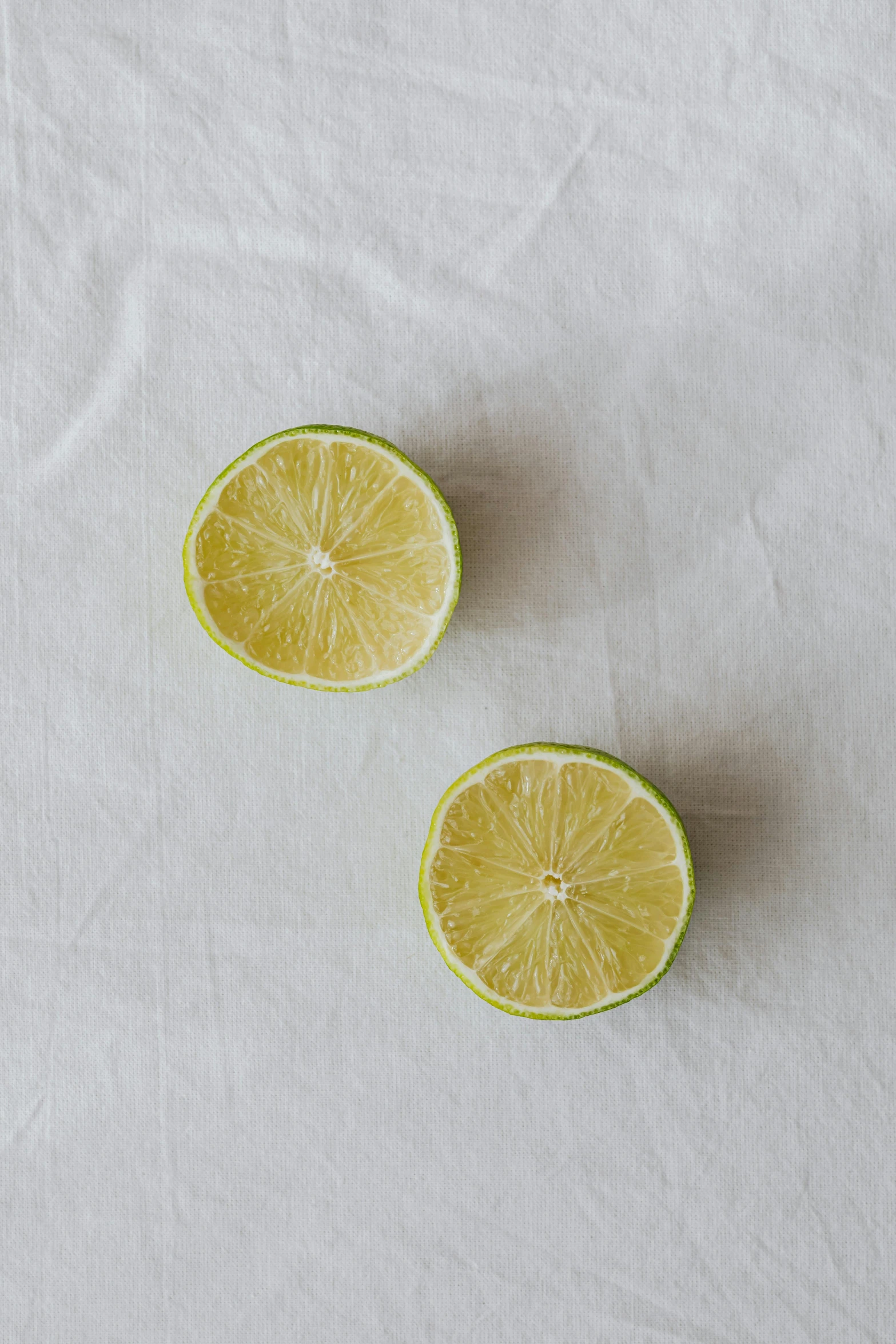 a couple of lemons that are on a surface