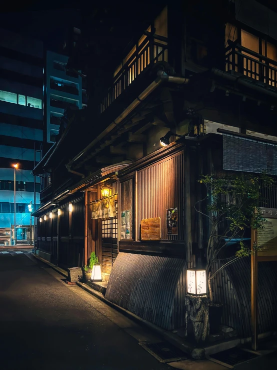 a house on the street with a lamp on