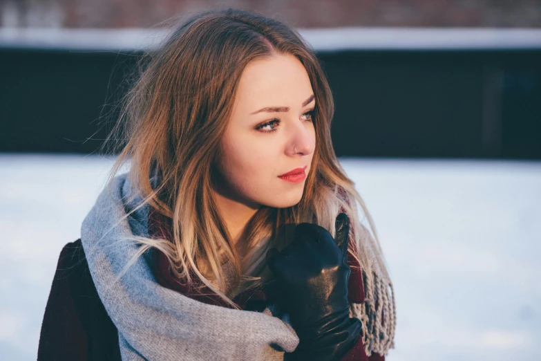 a woman is dressed warm, warm and bundled up