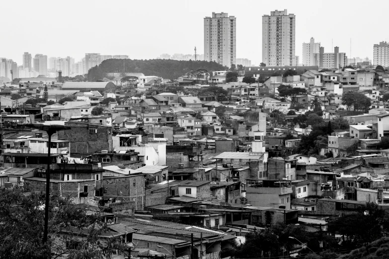 the black and white po shows a very long view of several city buildings