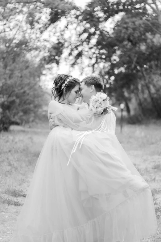 two women in long dresses emcing each other