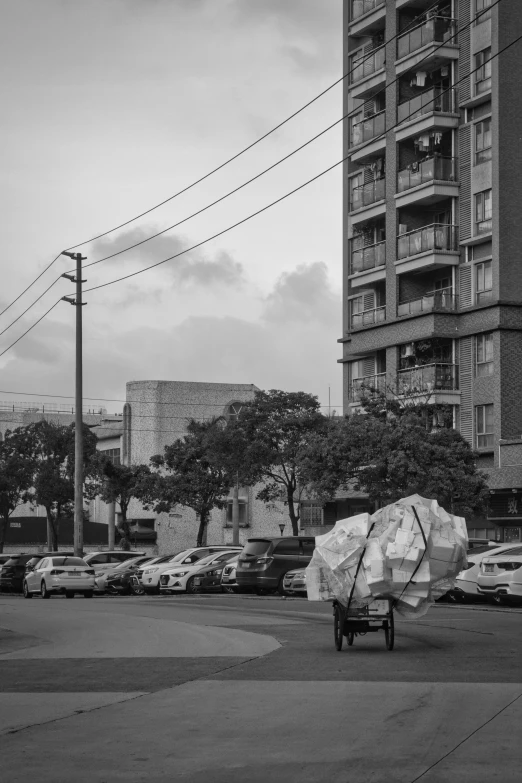 an umbrella is standing on a street corner