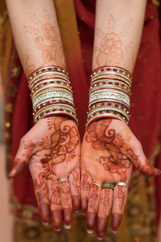 two henches are being put on the arm of a woman