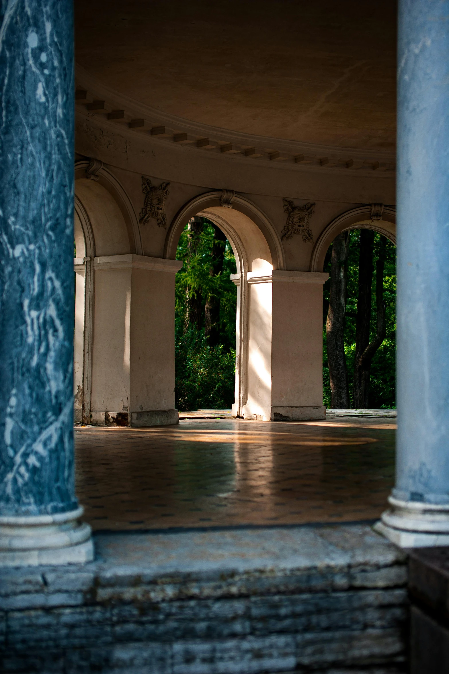 the inside of an old building with pillars and arches