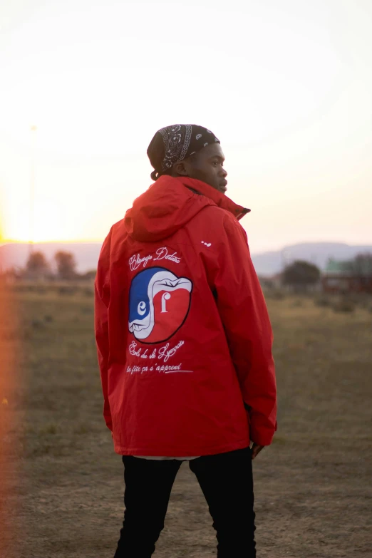 a person in a jacket looking back