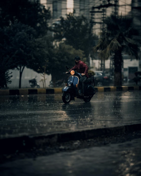 a man standing over a small child riding on a motorcycle