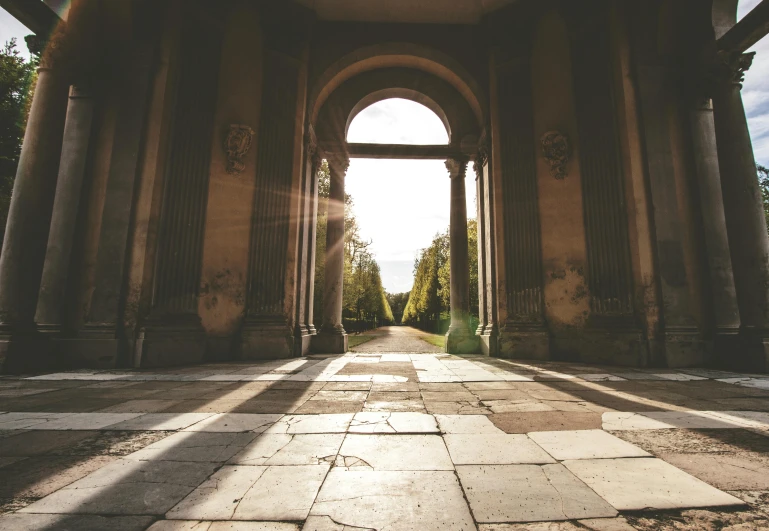 an arch in the center of a large building