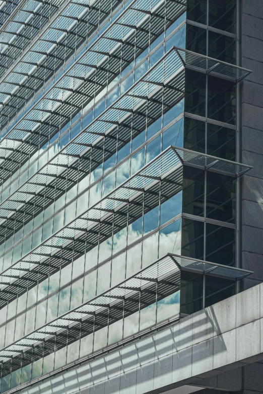 the facade of an office building that features glass and steel structures