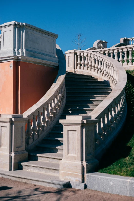 large stone staircase leading to a red building