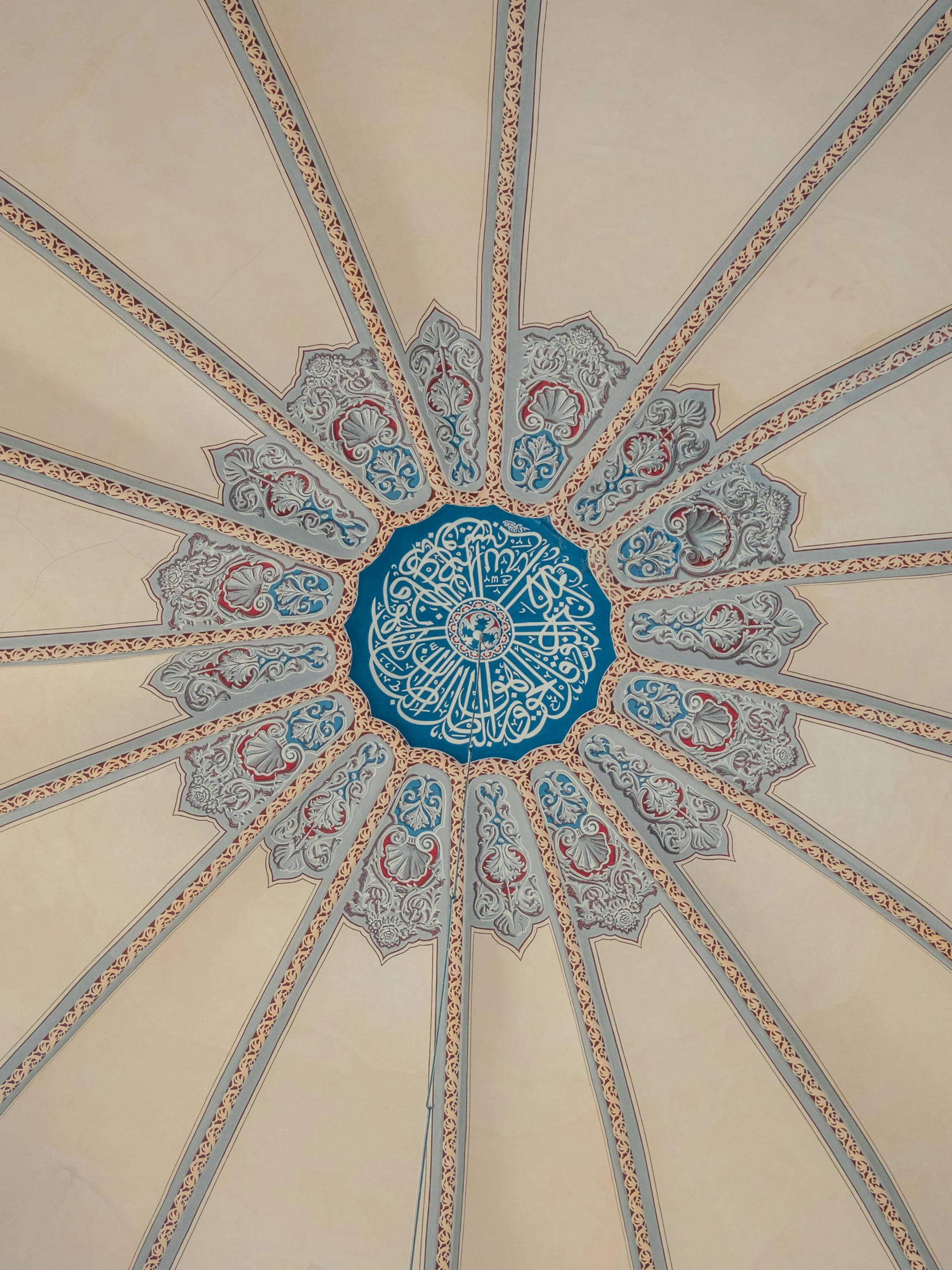 an elaborate design on the ceiling of a building