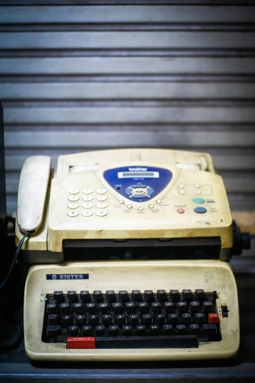 an old, outdated typewriter sitting on top of a table