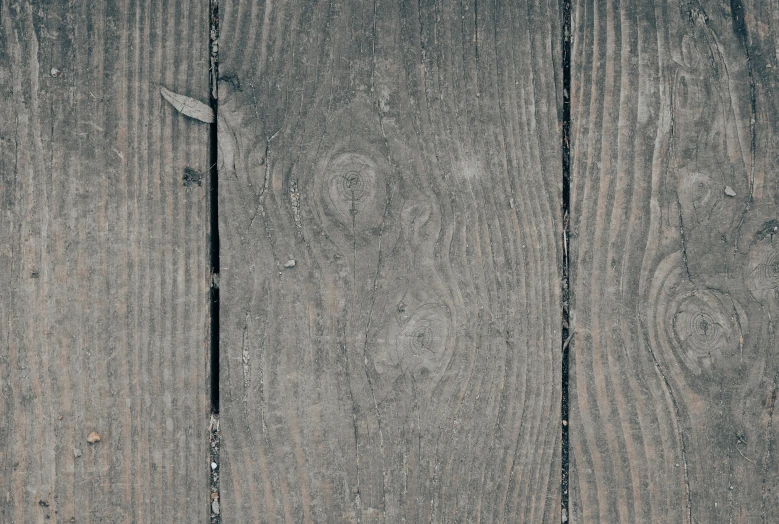 wooden planks with some black and white things on them