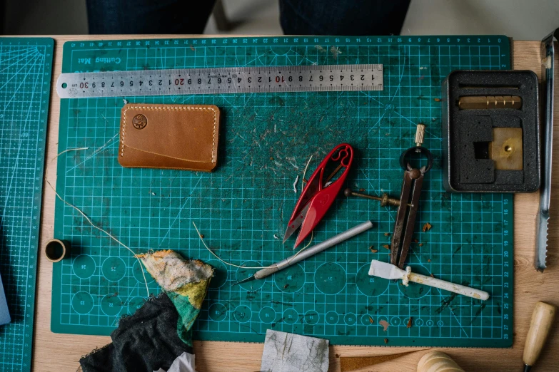 some random tools on a green  board