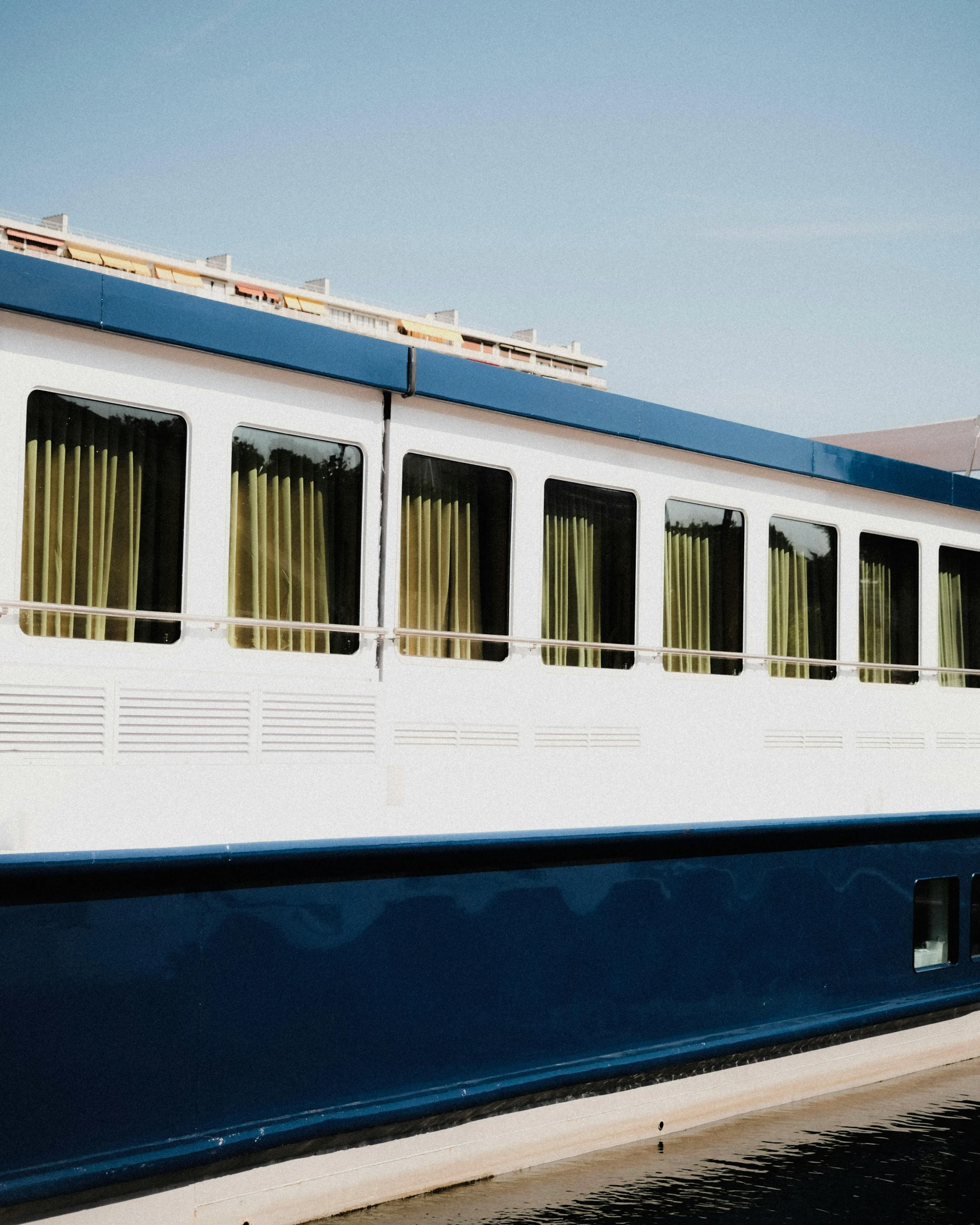 the back side of a boat, with windows and closed doors