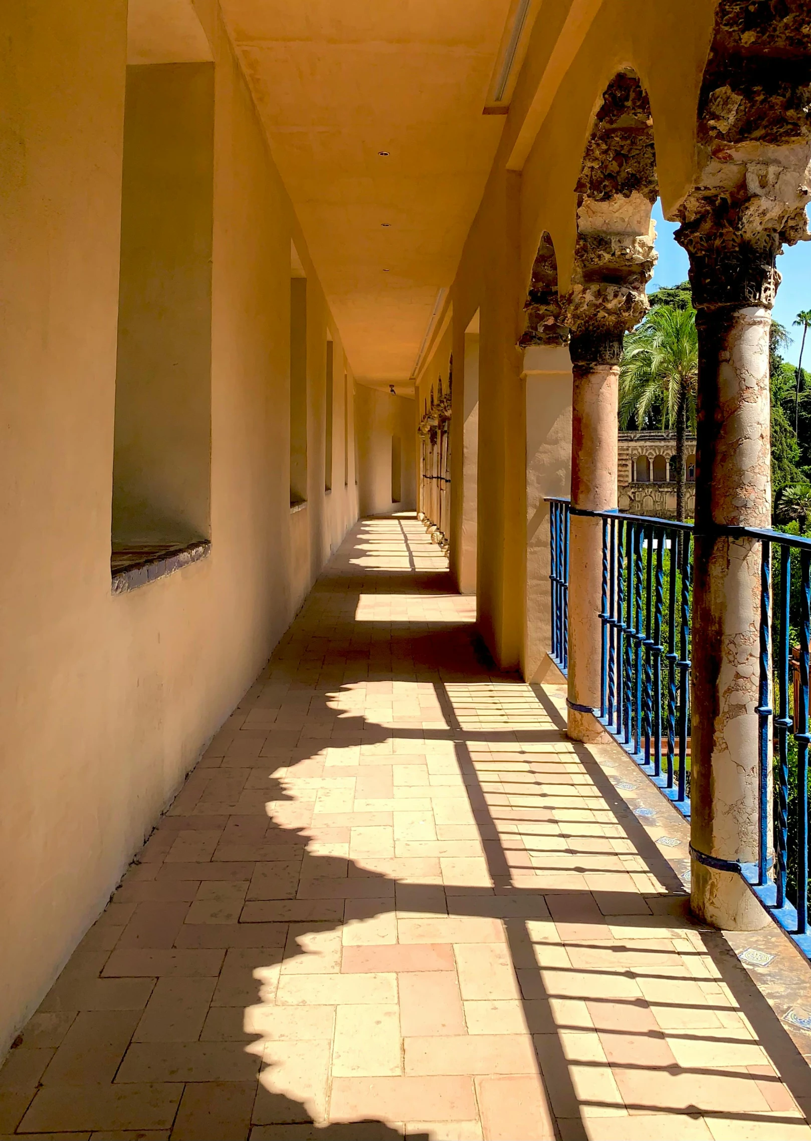 an image of a walkway lined with arches