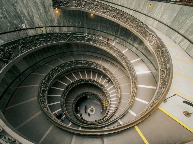 a spiral stairway that is made of marble