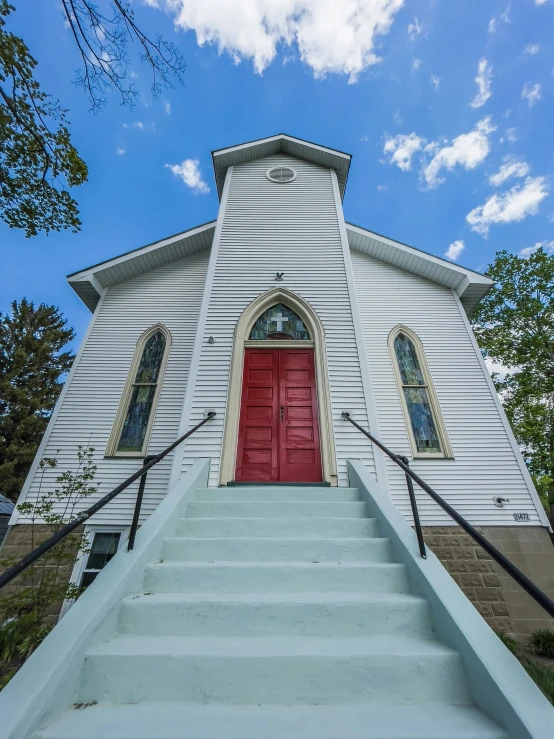 a church steeple with steps leading up to it