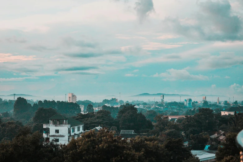 the view from the top of a building, looking over trees