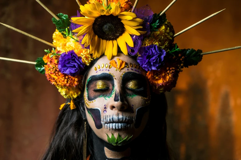 a woman with makeup on and painted is standing in front of a wooden wall