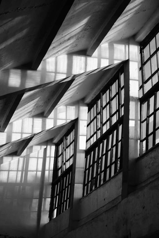 three windowed windows inside of a structure made of steel