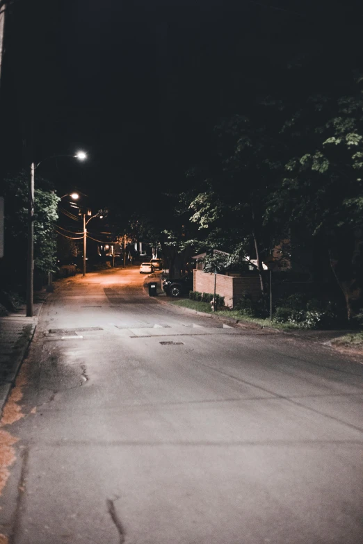 a dark night on an empty street with no cars or people