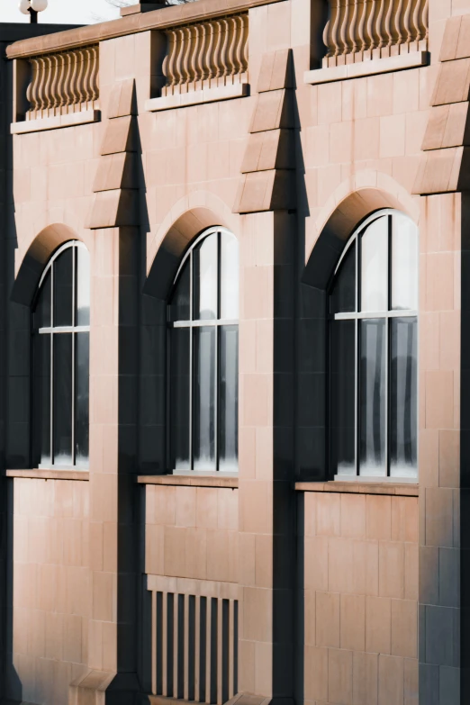 a large building with three arches over the windows