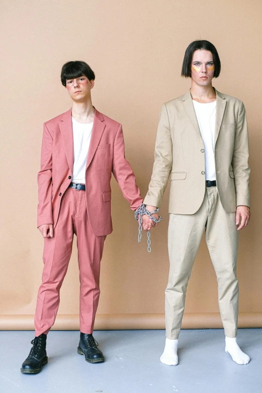 two male models are posed next to each other