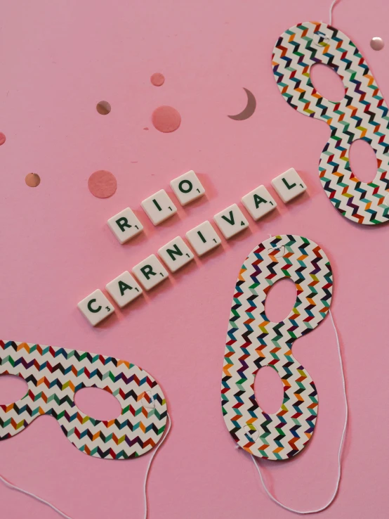 letters that spell out the words rio carnival on pink paper