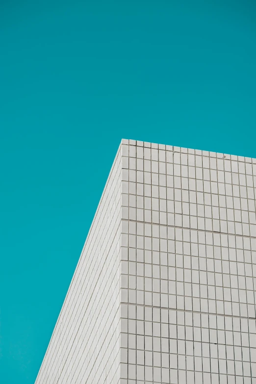 a building is seen against a blue sky